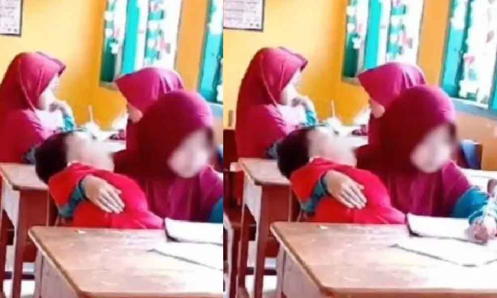 Kisah murid 7 tahun gendong adik ke sekolah setiap hari undang sebak ramai